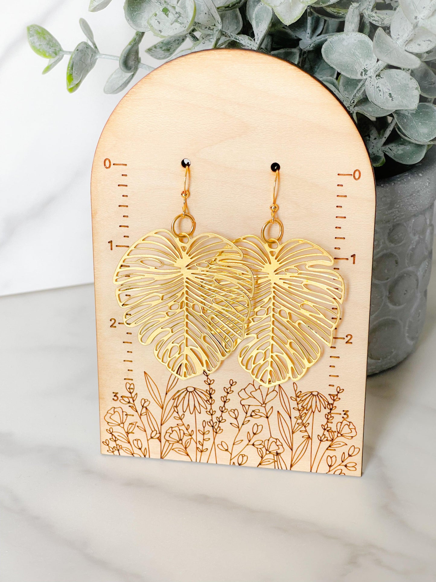 Gold statement leaf earrings